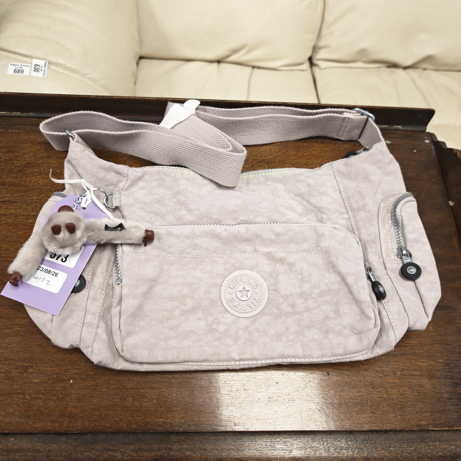 Lilac Kipling handbag with tag, front view.