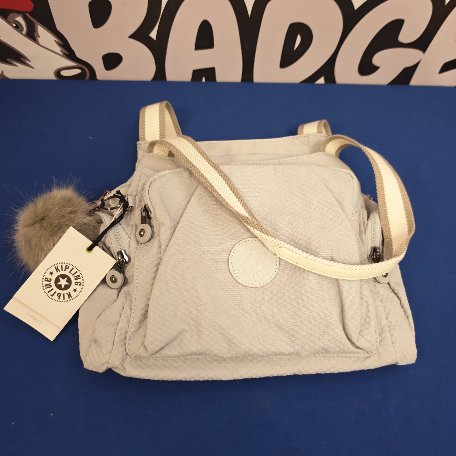 Unused Kipling shoulder bag with tags, front view.