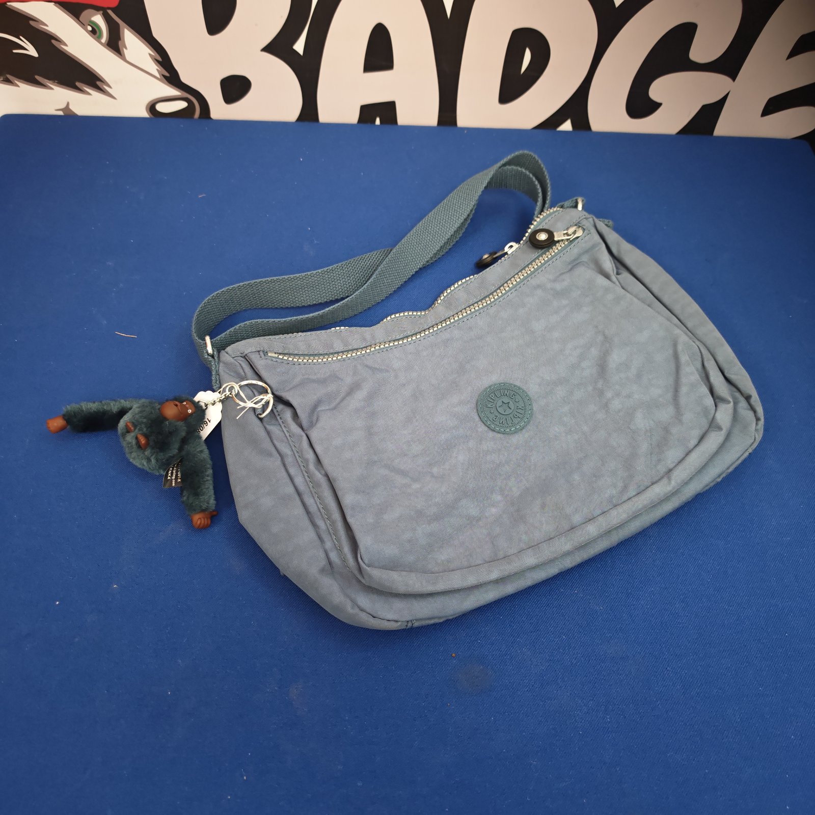 Vintage Kipling shoulder bag, front view, unused condition.