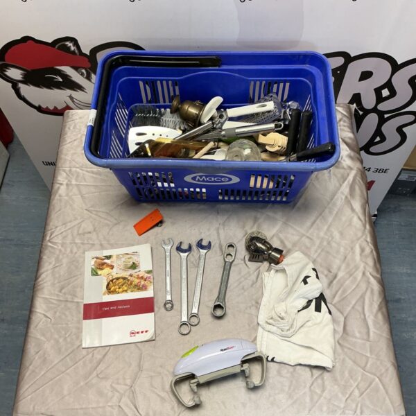 Basket of assorted kitchen utensils and tools.