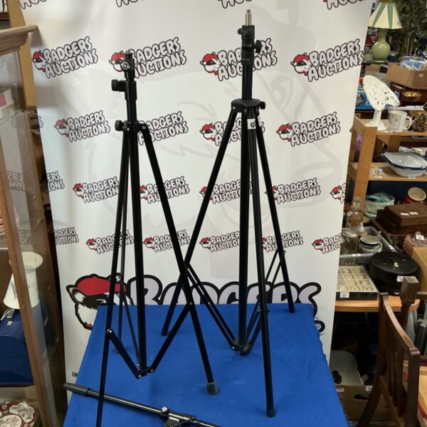Pair of black Konig and Meyer tripods for studio or stage use.
