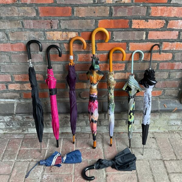 Collection of colourful ladies umbrellas, including Juicy Couture and Radley.
