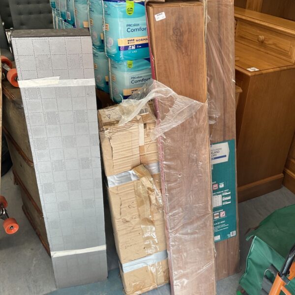 Stack of laminate flooring and underlay packs for home improvement.
