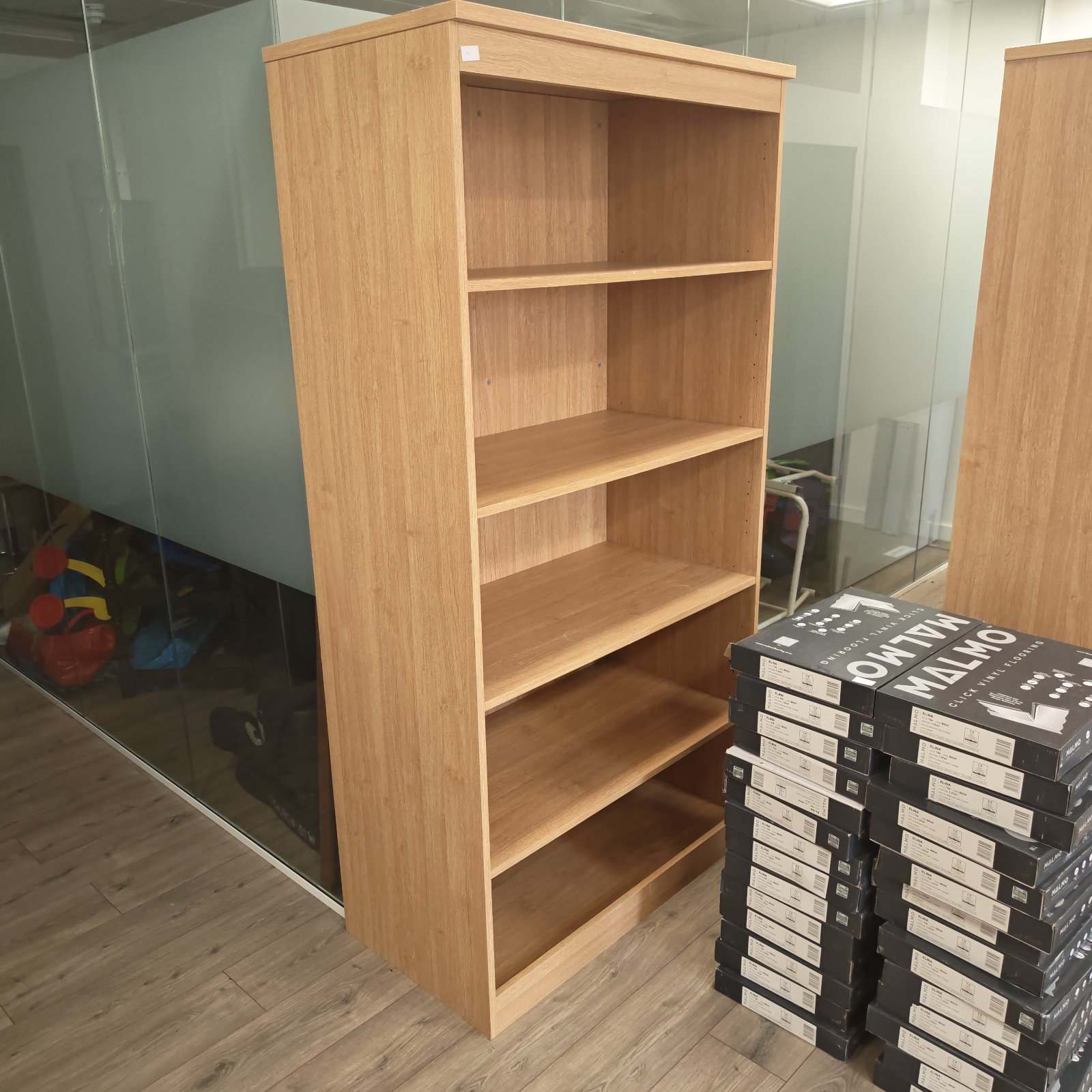 Large office bookshelf with multiple shelves for storage.