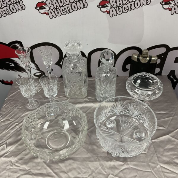Lead crystal collection featuring Royal Dalton bowls and a sunflower decanter.