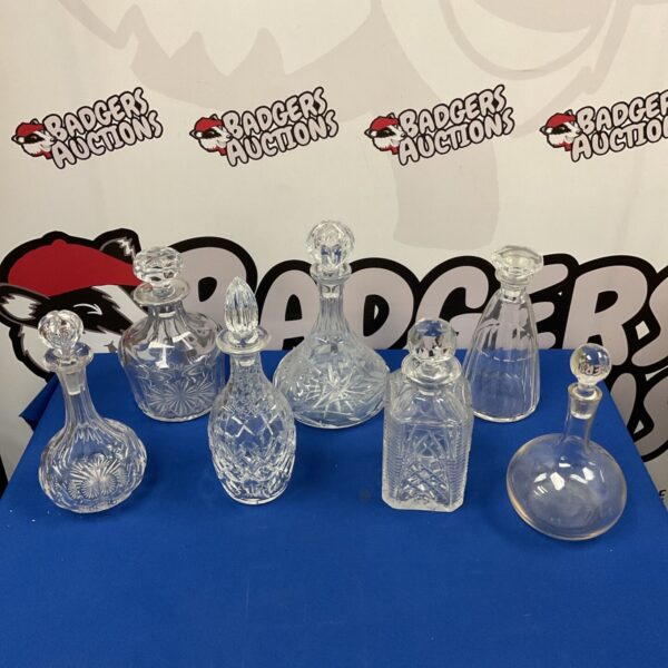 Lot of seven vintage lead crystal cut decanters.