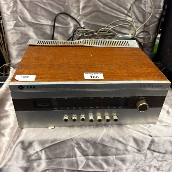 Front view of vintage Leak Delta FM tuner with wooden cabinet.