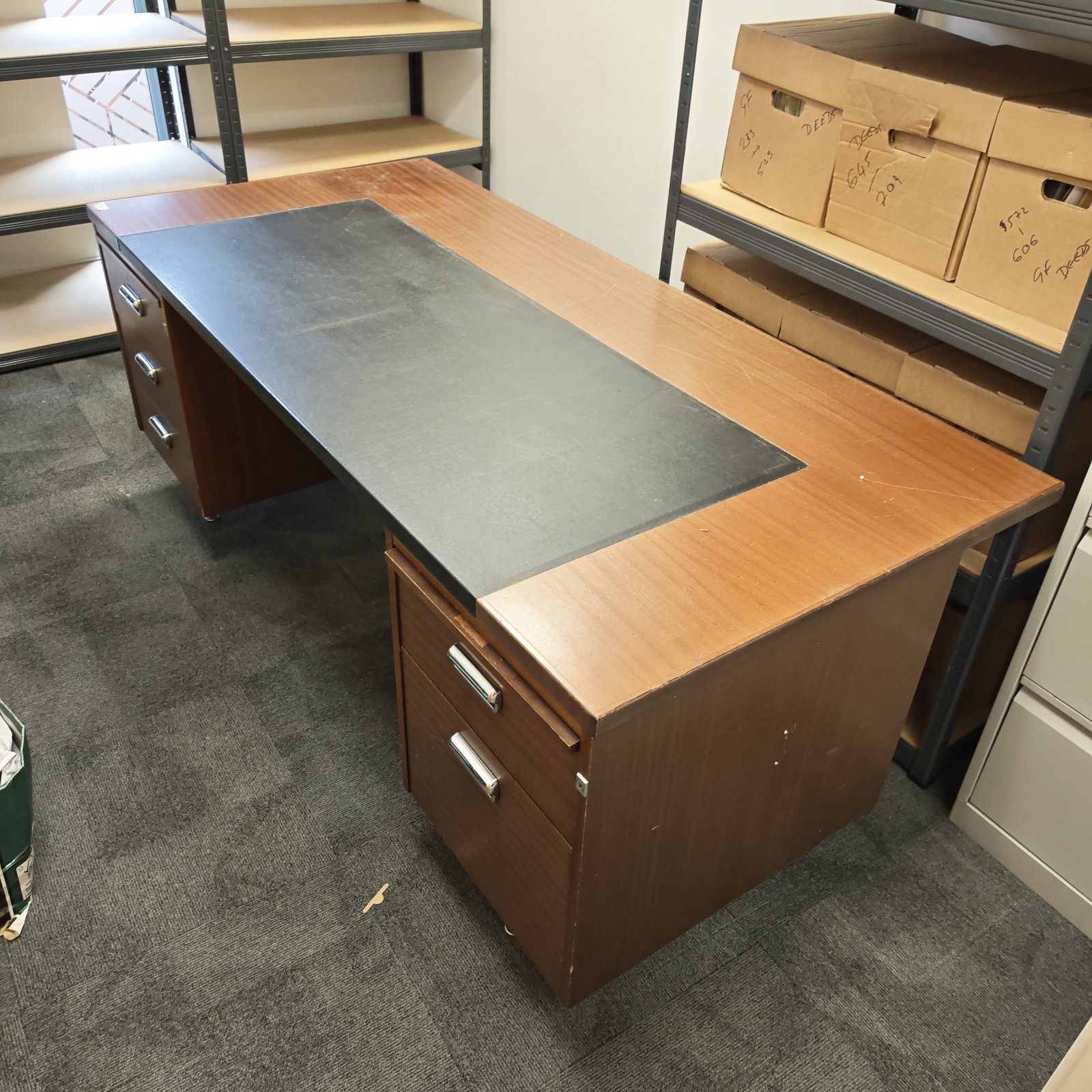Vintage leather top writing desk with drawers, classic office furniture.