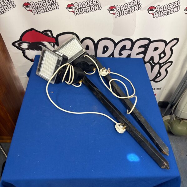Pair of used LED site lights for portable illumination.