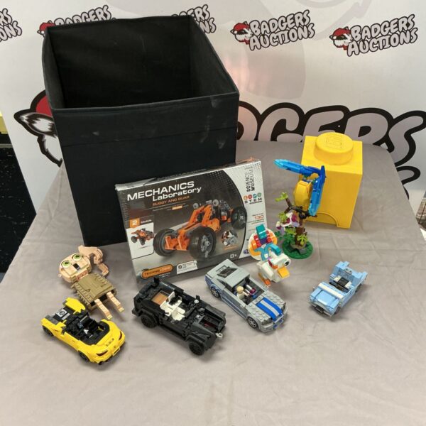 Lego cars and Science Museum Mechanics Laboratory set in a box.