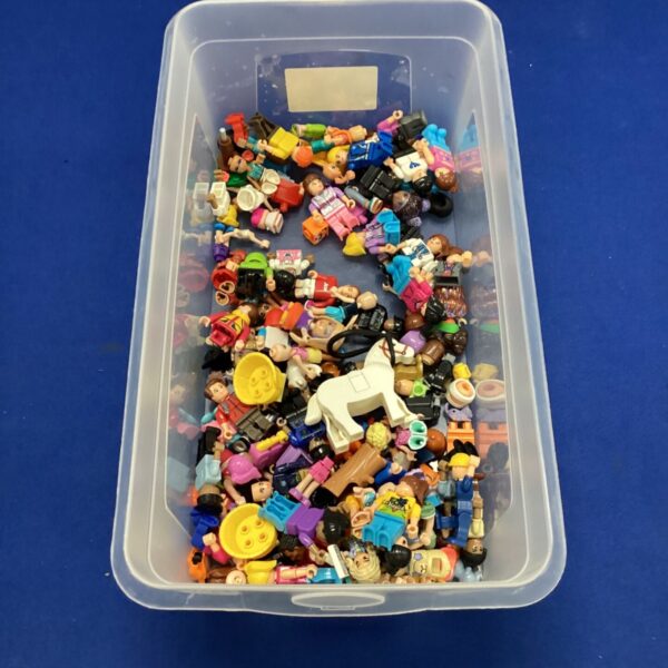 Mixed lot of Lego mini figures and other plastic toys.