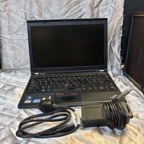 Lenovo Thinkpad X230i laptop with charger, a vintage business computer.