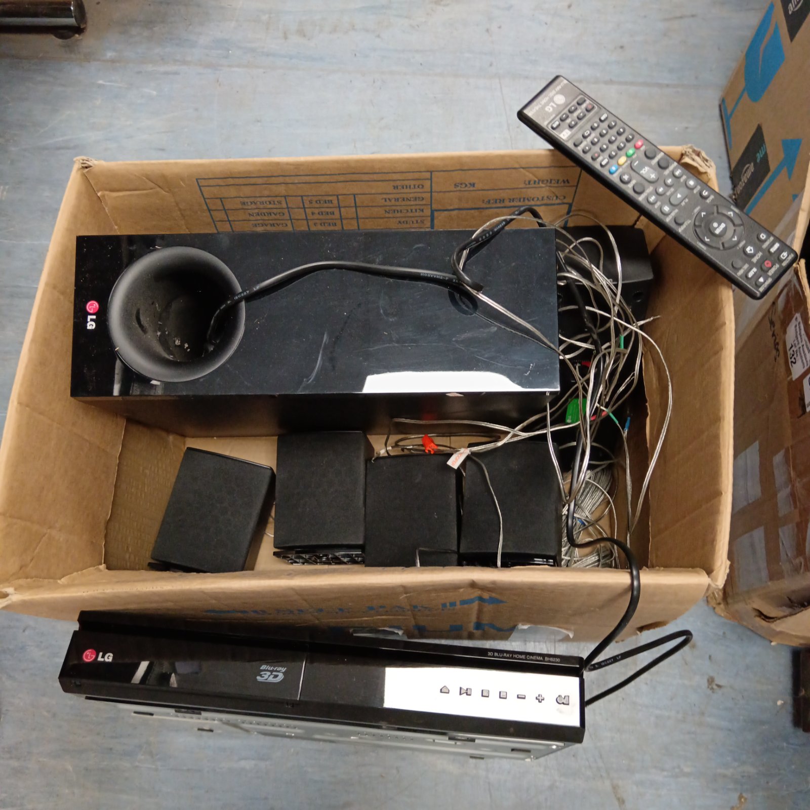 LG 3D Blu-ray player BH6230 and surround sound system components.