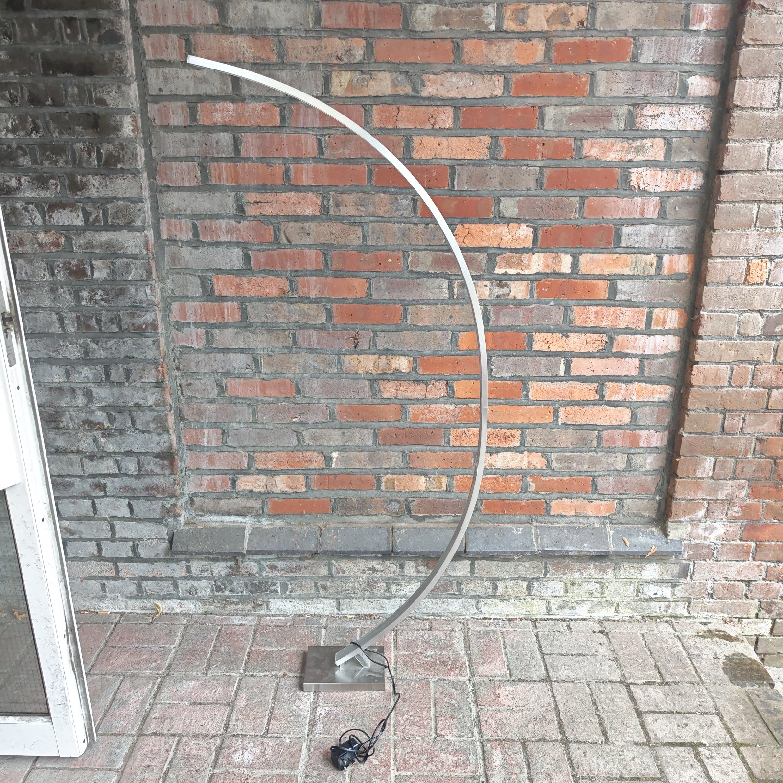 Silver Livarno curved LED floor lamp for modern home lighting.