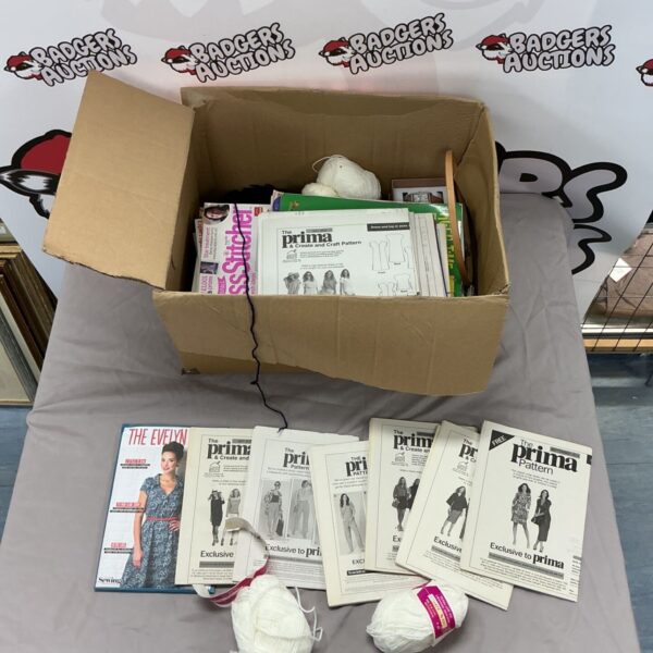 Box of knitting patterns with yarns