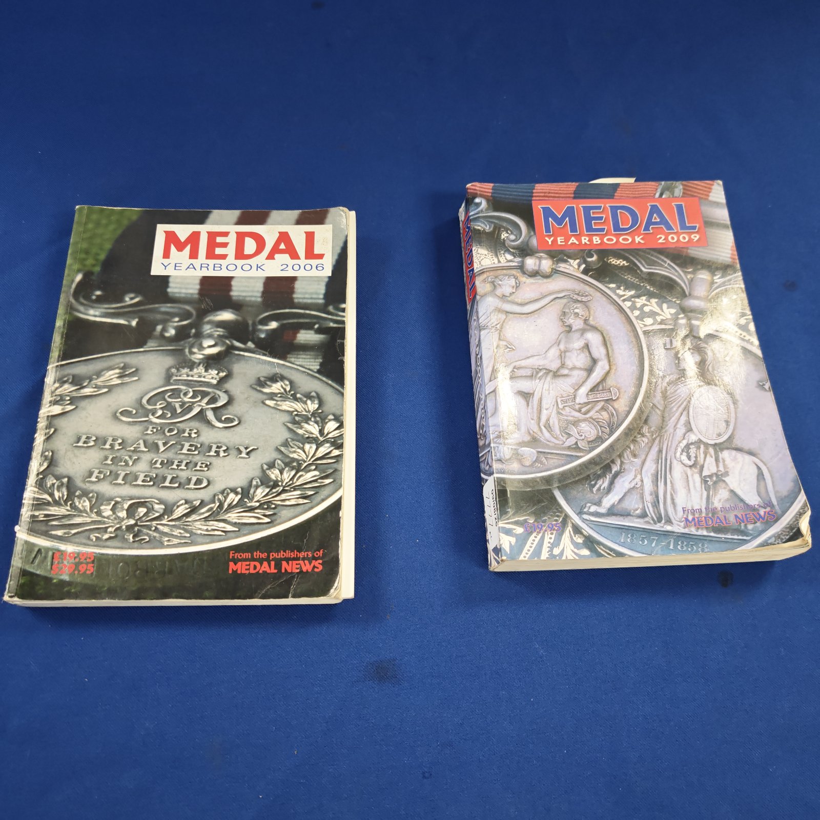Two medal yearbooks Inc 2006 & 2009