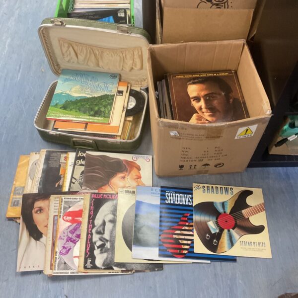 Box full of mixed 12’ vinyl records and vintage suitcase of 7’ vinyl inc the shadows