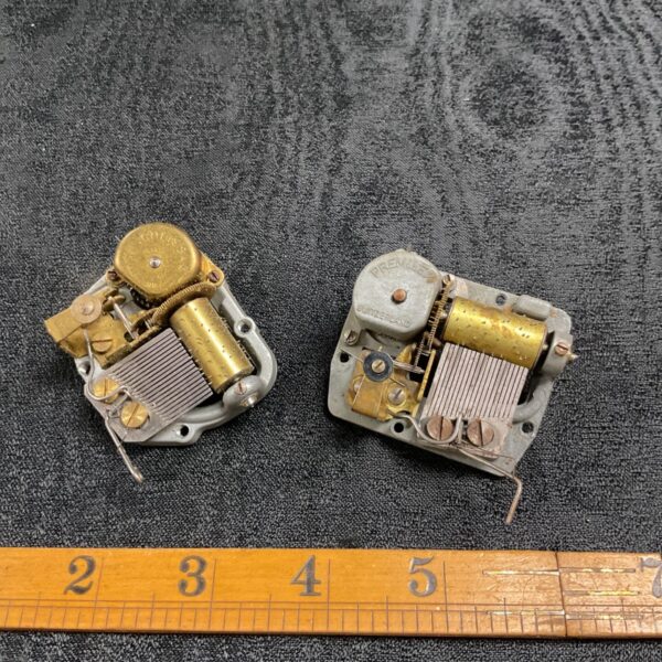 Two vintage swiss clockwork music mechanical movements both working