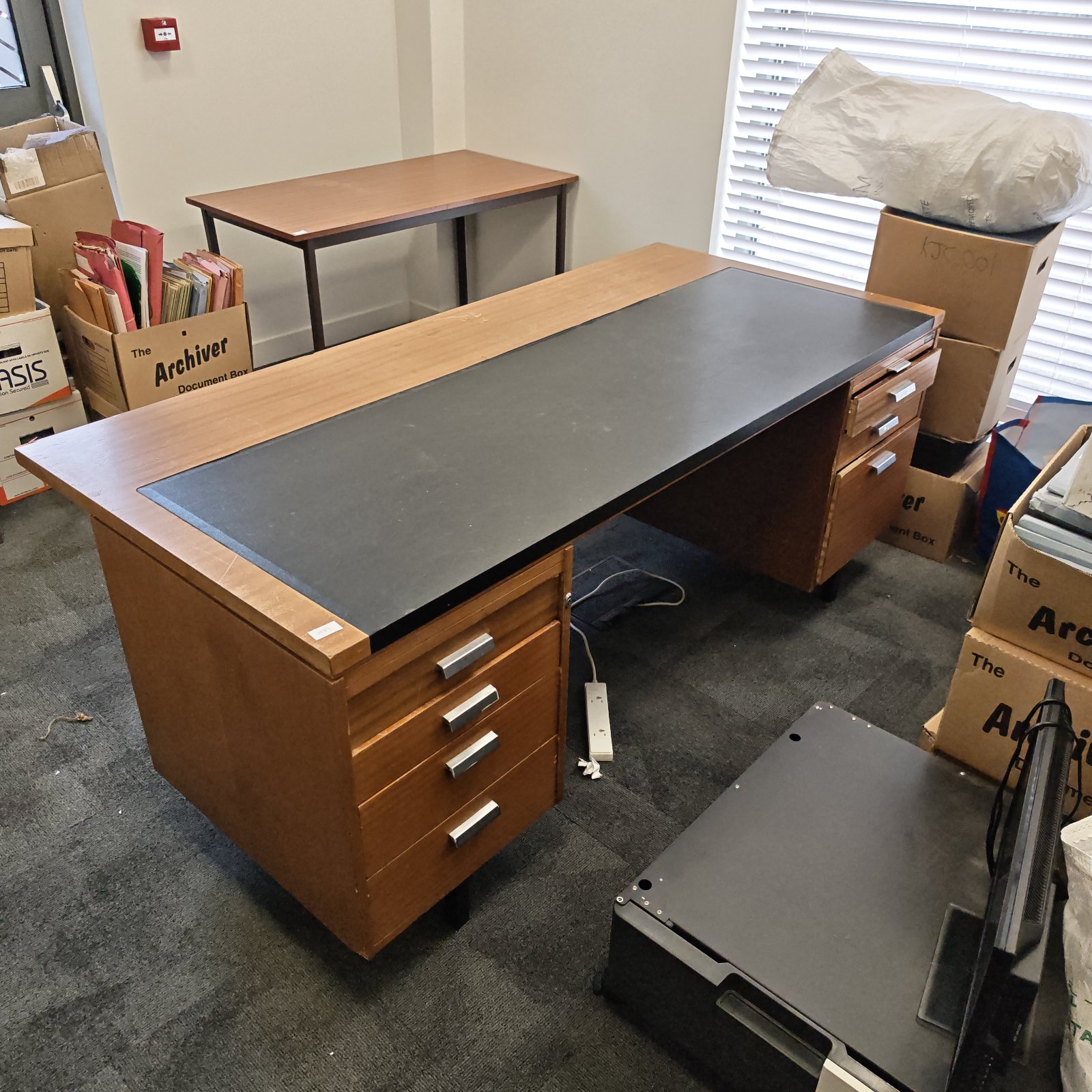 Black leather topped writing desk with drawers