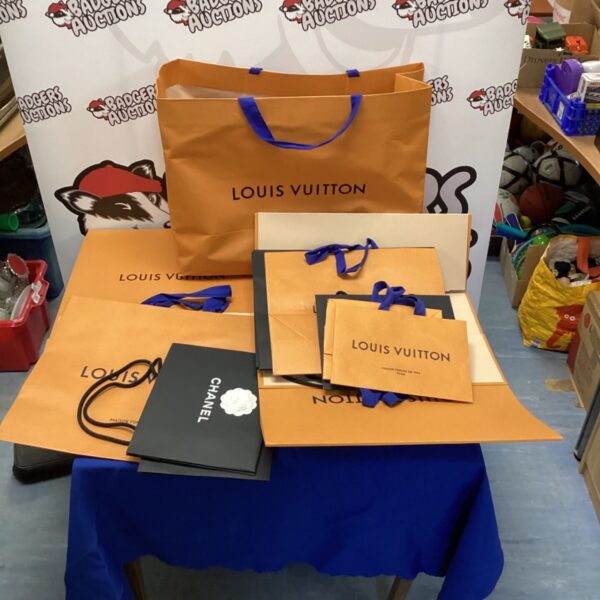 Louis Vuitton and Chanel bags and boxes in a mixed lot.