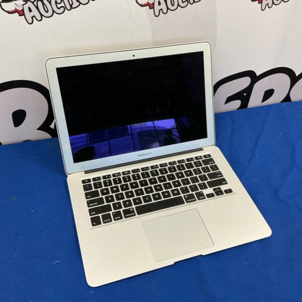 Silver Apple MacBook Air A1369 laptop, open on a surface.