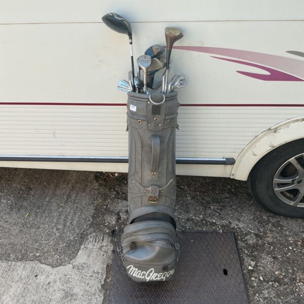 Vintage MacGregor golf bag with a set of clubs.
