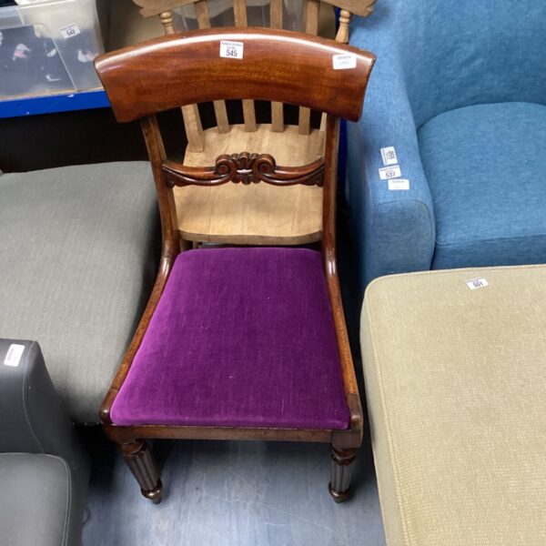 Antique 19th century mahogany bedroom chair with purple upholstery.