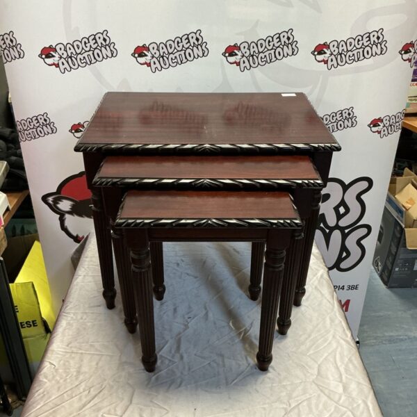 Vintage mahogany nest of tables with column legs.