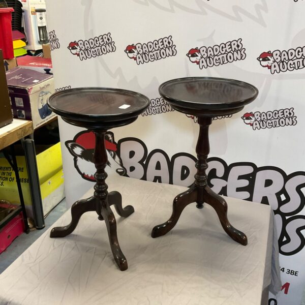 Pair of antique mahogany wine tables with tripod legs.