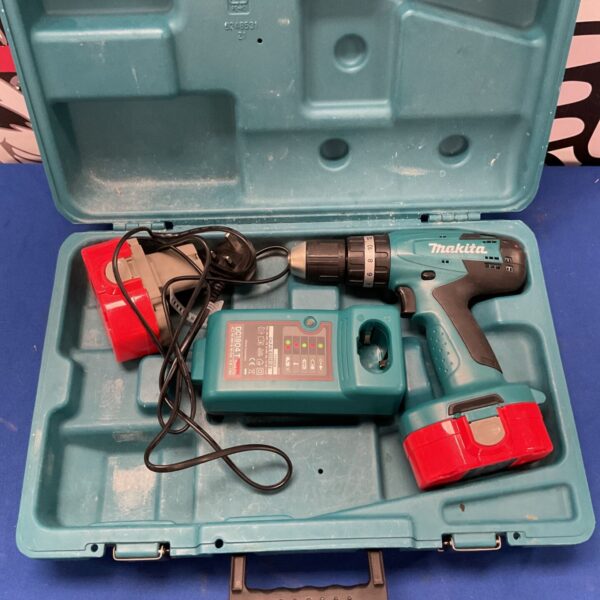 Makita 8391D combi drill in open case, showing tool and battery compartment.