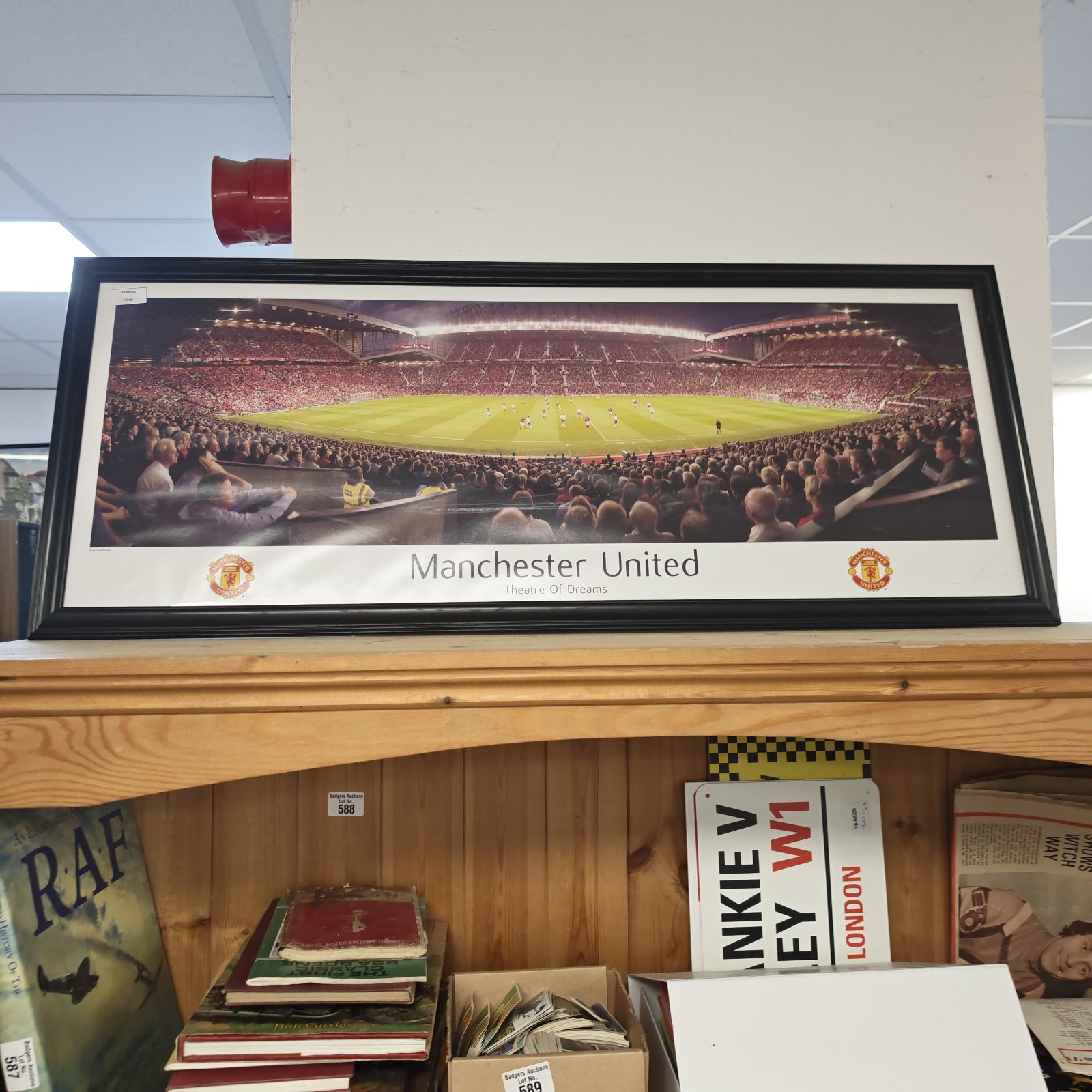 Framed Manchester United photo of Old Trafford stadium.