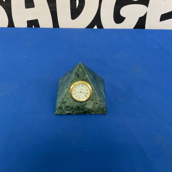 Leeman Design marble pyramid desk clock on a surface.