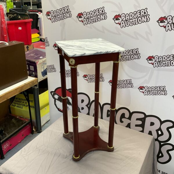 Vintage marble top plant table with turned legs.