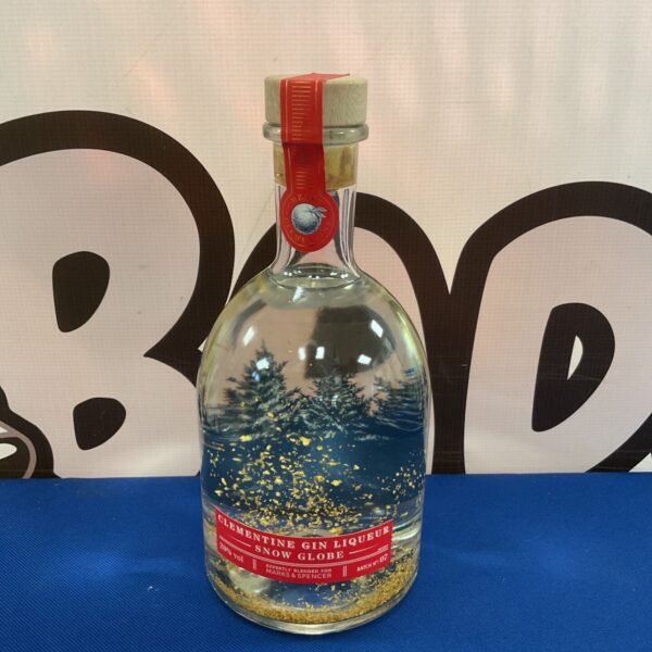 Sealed Marks & Spencer clementine gin liqueur snow globe bottle.