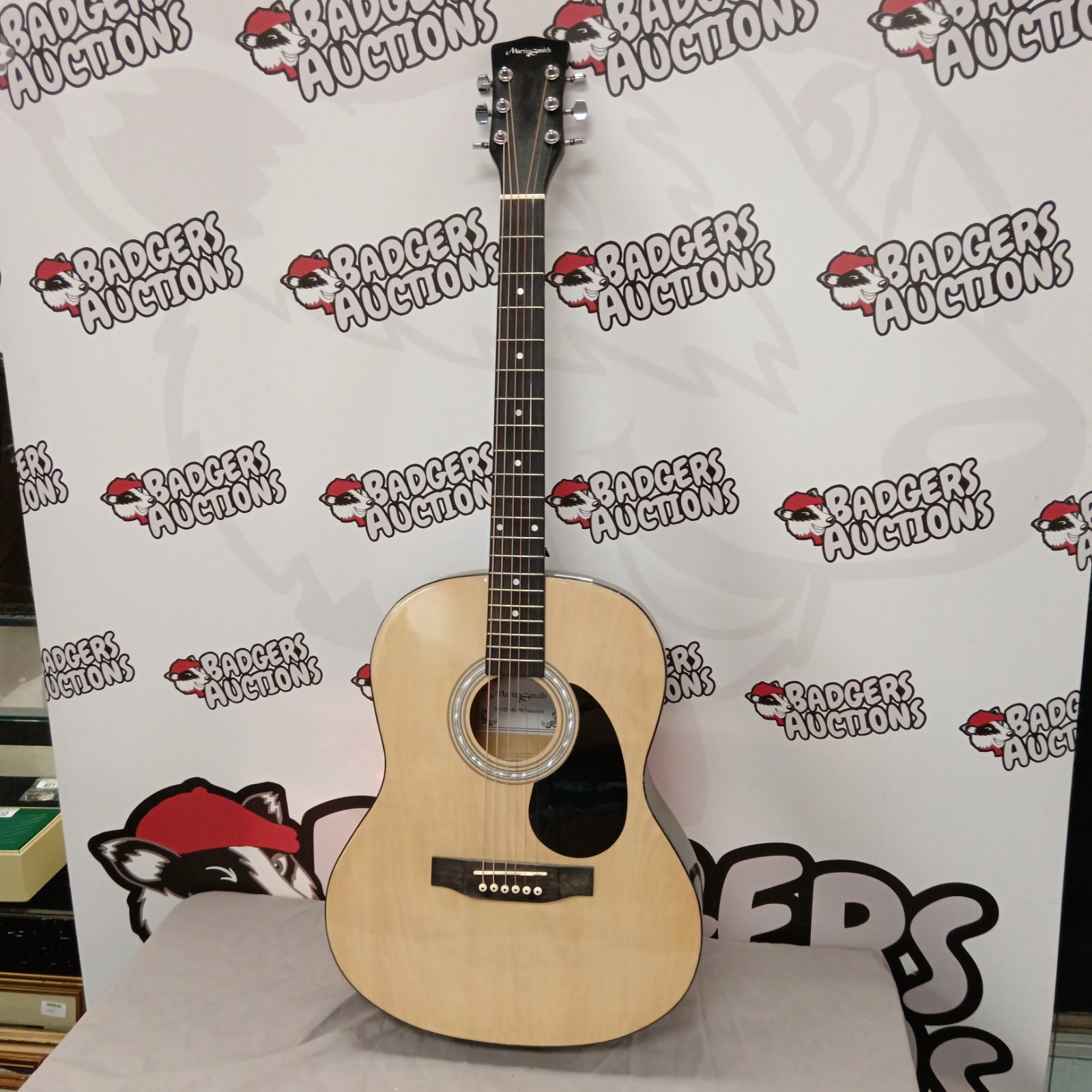 Martin Smith acoustic guitar in light finish.