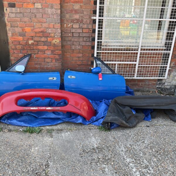 Mazda MX5 MK1 parts lot including doors and bumper.
