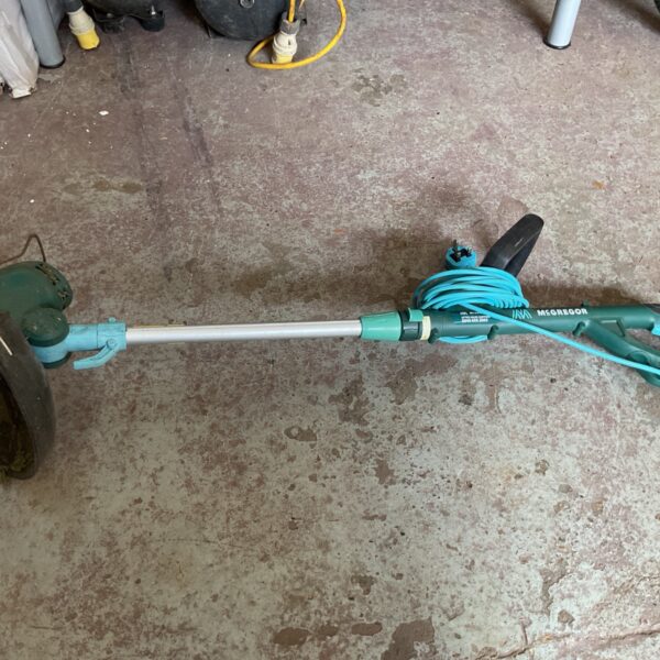 Used McGregor corded grass trimmer for garden lawn maintenance.