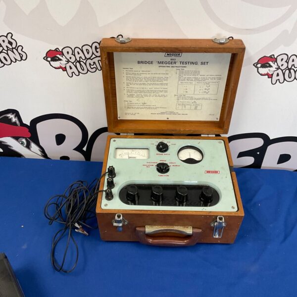 Vintage Megger Bridge Testing Set with dials and connections.