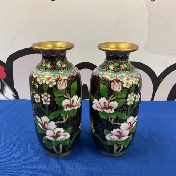 Pair of antique Japanese Meiji cloisonné vases with floral designs.