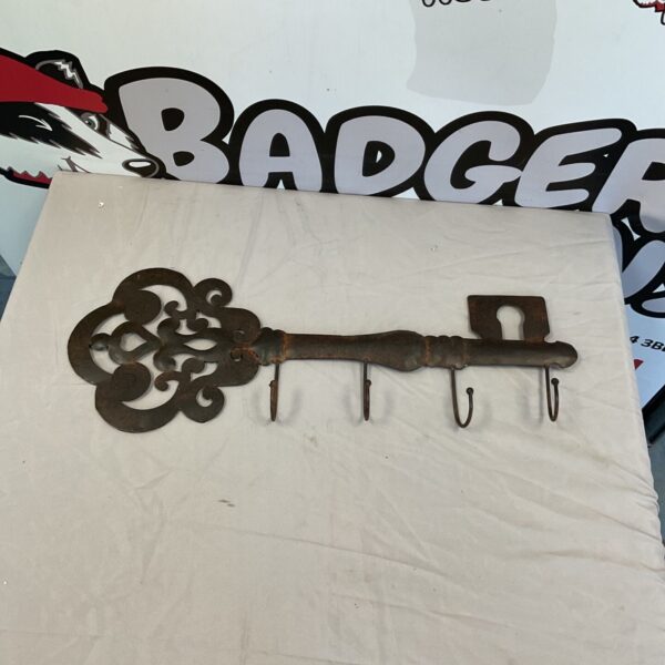 Vintage metal key coat hook for wall mounting.