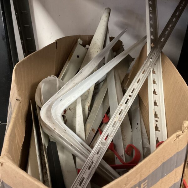 Mixed lot of metal shelving components for DIY storage.