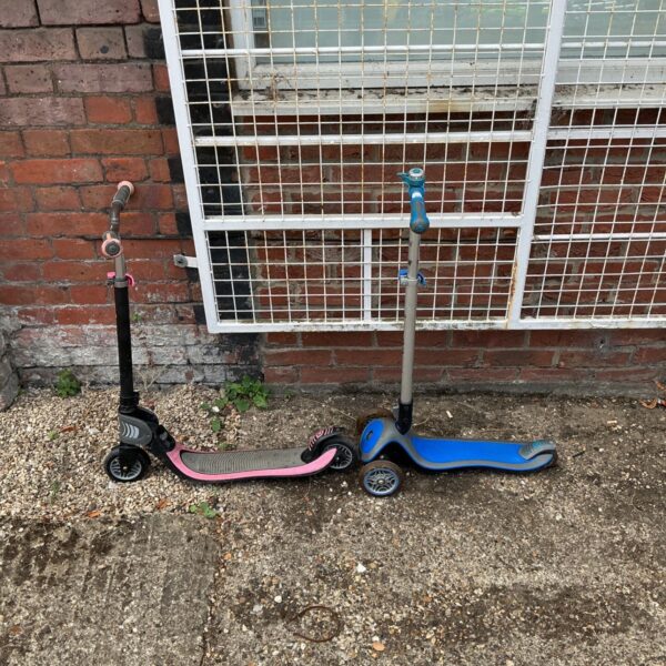Blue and black Micro scooter for children's outdoor play.