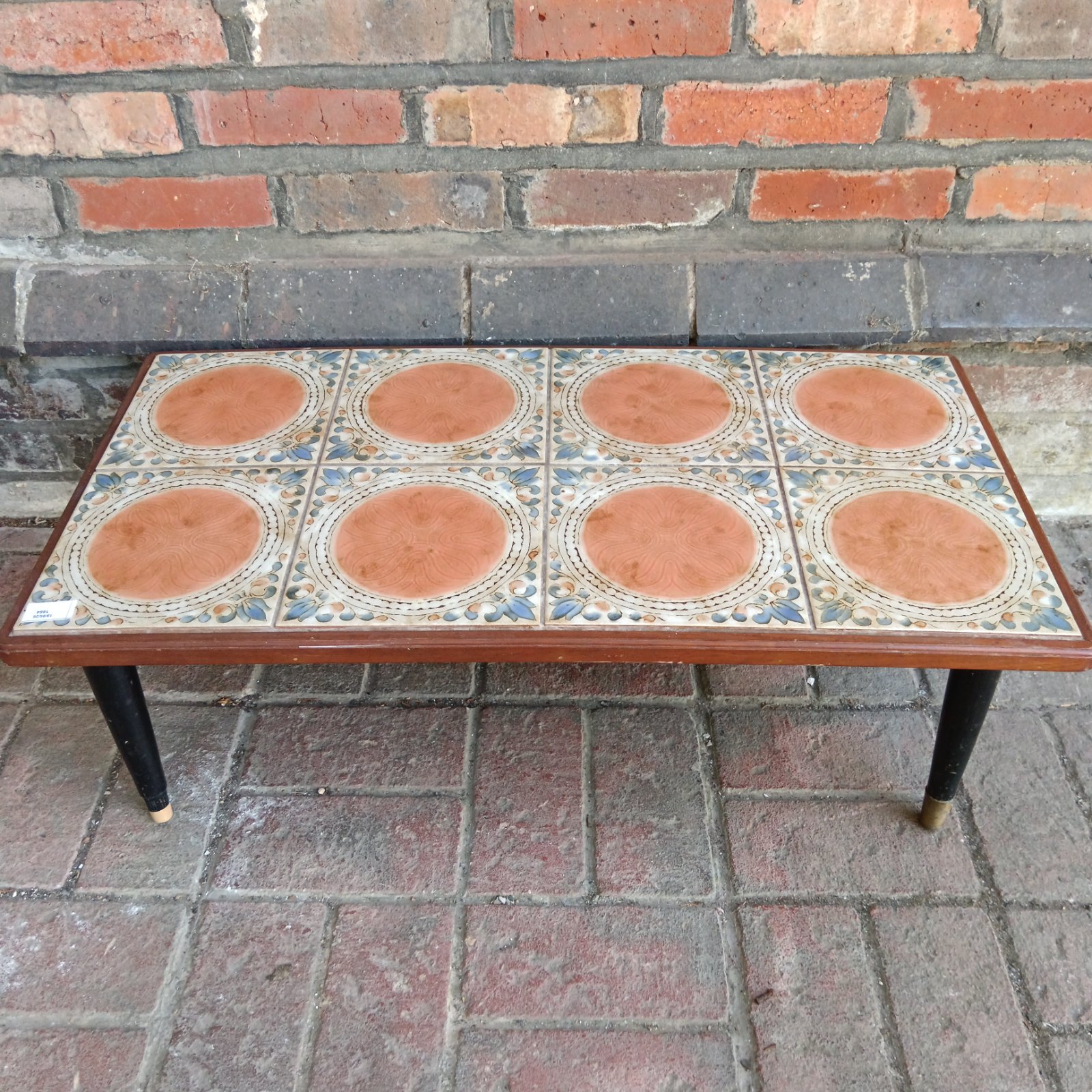Vintage mid-century modern coffee table with ceramic tile inlay.