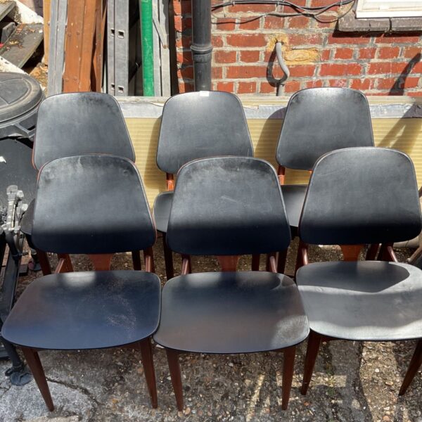 Vintage mid-century modern dining chair with wooden legs.