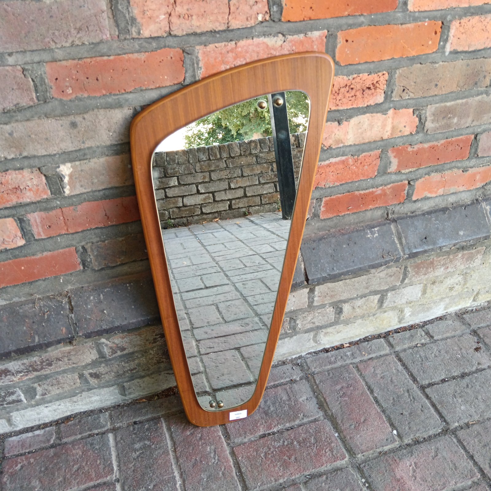 Vintage mid-century modern teak asymmetrical wall mirror.