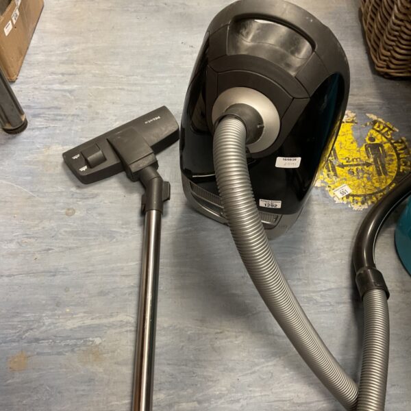 Used Miele Complete vacuum cleaner with hose visible.