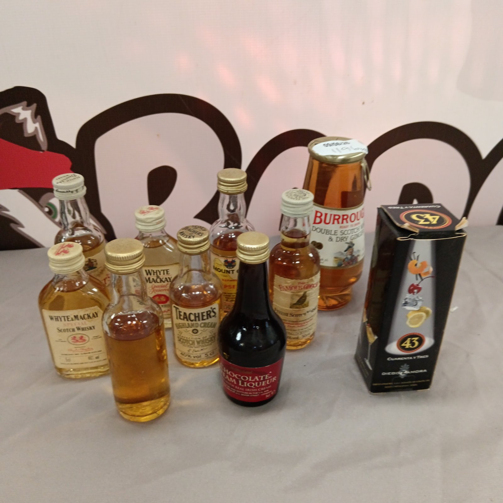 Collection of miniature whisky and rum bottles for collectors.
