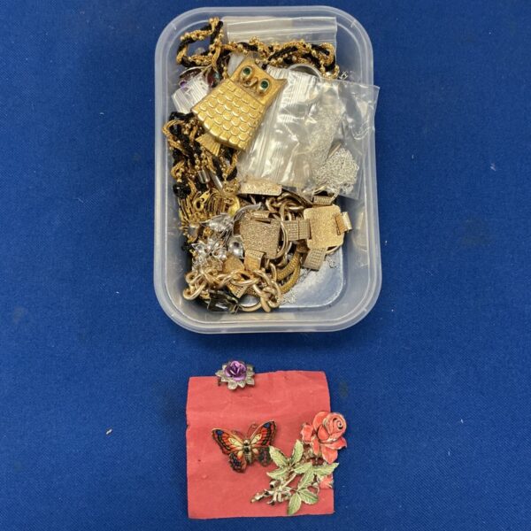 Tray of mixed jewellery including gold tone necklaces and chains.