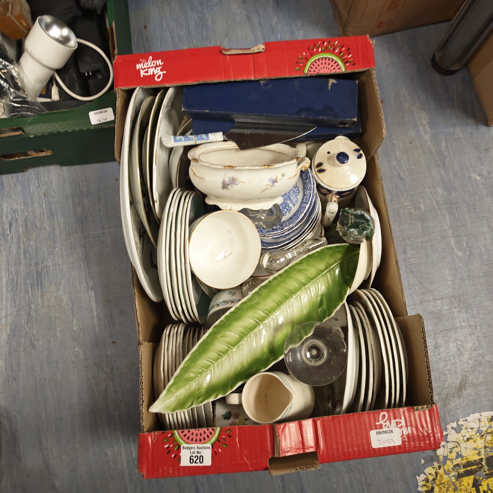 Mixed kitchenware lot with blue and white china plates and bowls.