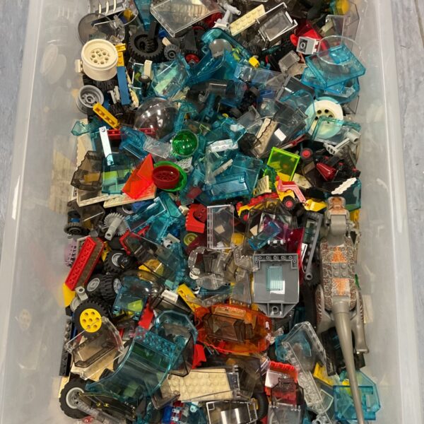 Large crate filled with a mixed Lego lot of colourful building blocks.
